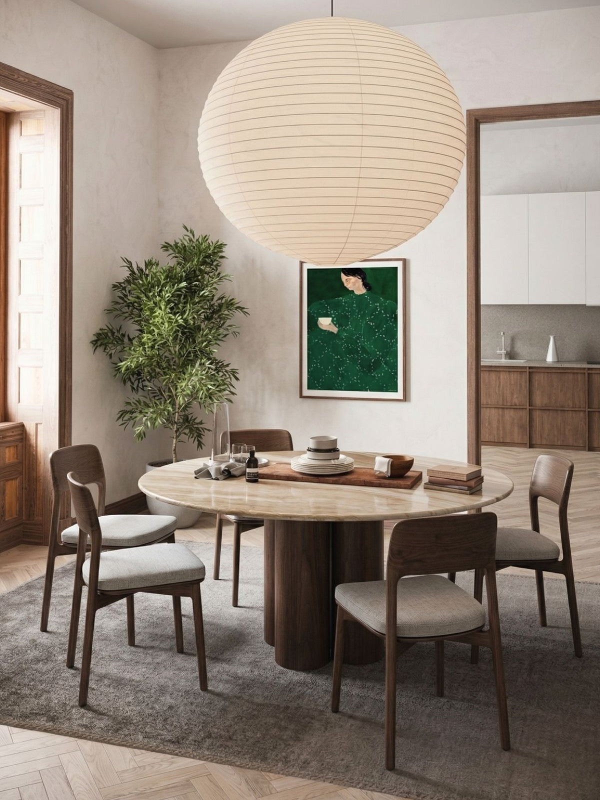 Dining room with a round wooden table and chairs, large spherical light fixture, and plants.